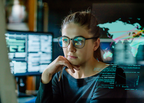 Woman with glasses working on a computer