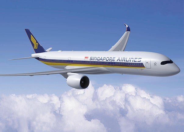 Singapore airlines plane flying in blue skies