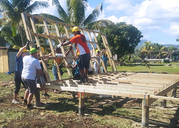 Group of people building home in Fiji