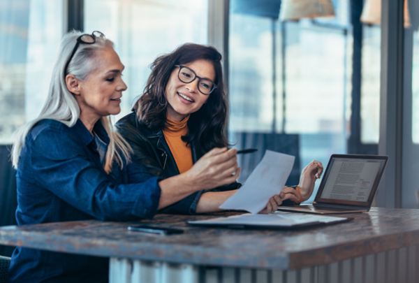 two ladies making notes