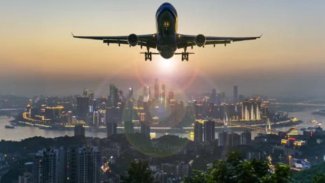Airplane flying over China highlighting the reopening of China borders which is a 2023 travel highlight.