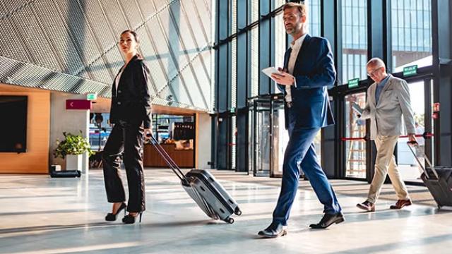 A group of people walking through the airport, symbolising the focus of Flight Centre Travel Group ahead of their Annual General Meeting.