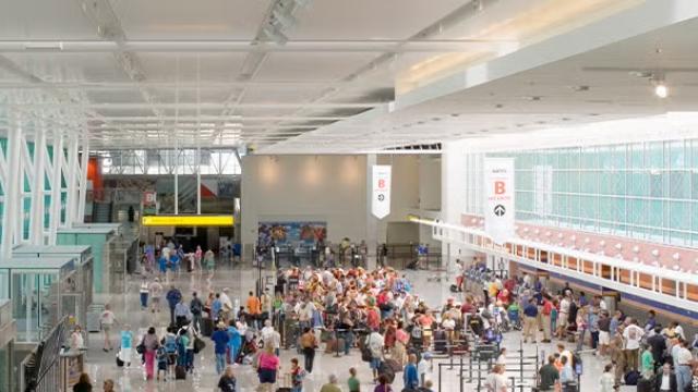 Passengers at the airport with new data from Flight Centre’s flagship corporate divisions revealing average domestic outbound Economy air fares across all carriers have decreased by 10 per cent in the second half of 2023