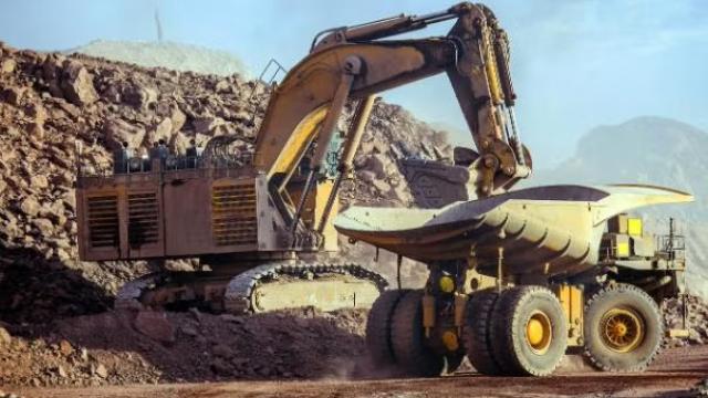 Construction vehicle in an open field demonstrating how smarter travel maximises savings for Aletek.