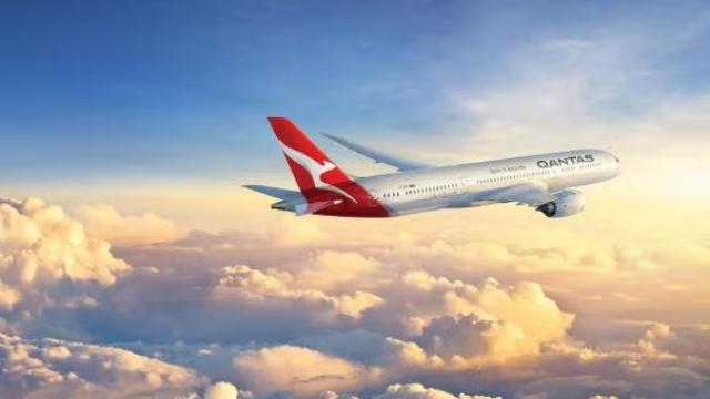 Qantas plane in the sky representing FCTG partners with Qantas as new distribution model takes off.