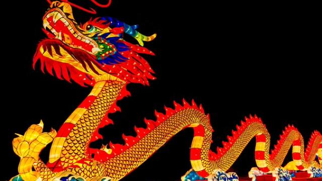 Illuminated dragon display symbolising Lunar New Year traditions and business customs.