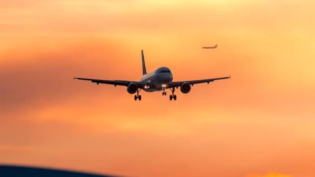 A plane in the sky highlighting Australia air travel's return to pre-Covid capacity