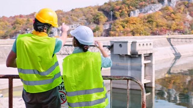 Construction workers onsite representing construction-related travel boom.