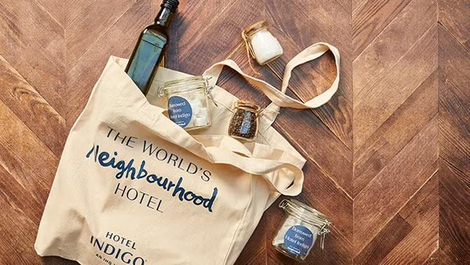 IHG’s Hotel Indigo tote bag, bringing back the lost art of borrowing from your neighbor, highlighting a unique and memorable experience in 2023 travel.