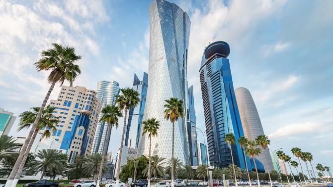 Stunning Doha skyline with modern architecture, capturing the rise of bleisure travel - one of 2023's standout travel highlights.