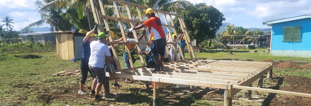 Group of people building home in Fiji