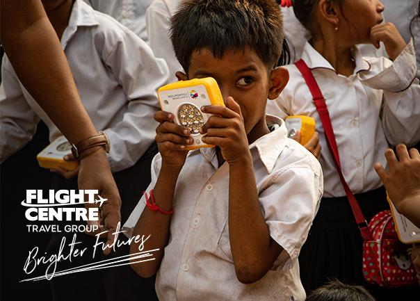 Child holding SolarBuddy light