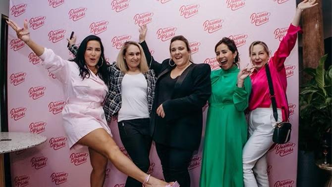 Women networking at a business event, celebrating Corporate Traveller's partnership with Business Chicks—a standout travel highlight of 2023.