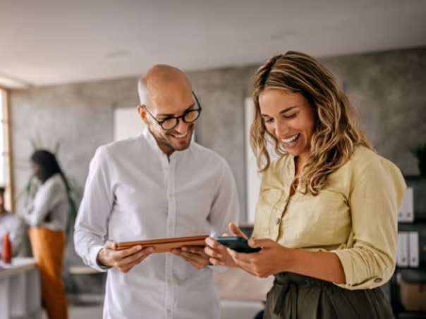 Two people talking in the workplace representing the importance of the SME Toolkit 