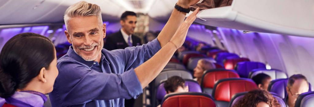 Man talking to flight attendant