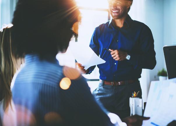 Man presenting to group of people