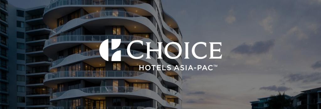 Exterior hotel shot of Choice Hotel with Choice logo overlayed