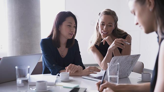 CoT-HW-Female Professionals Looking at Laptop in office