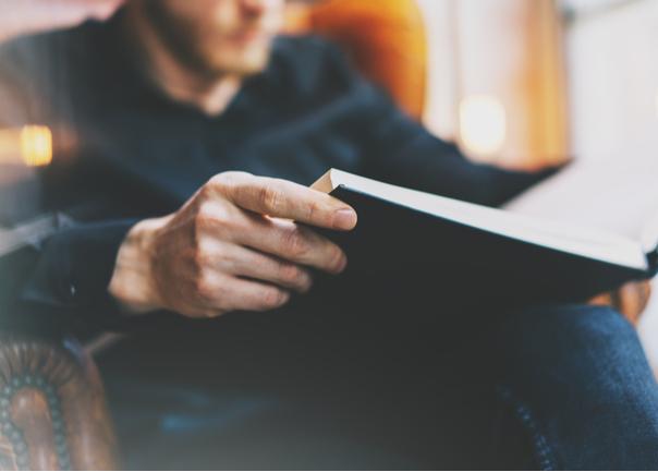 Male reading a book