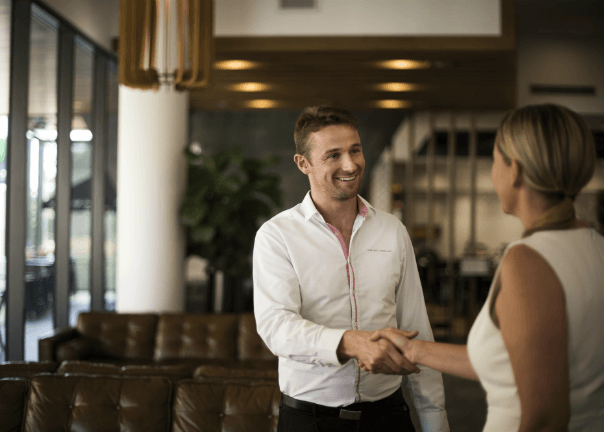 Man shaking hand in business hotel