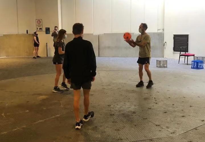 People playing basketball for exercise demonstrating how to survive a hotel quarantine. 