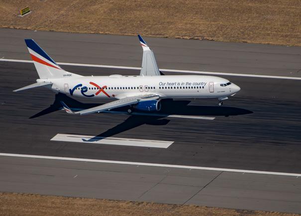 Rex flight taking off from a tarmac