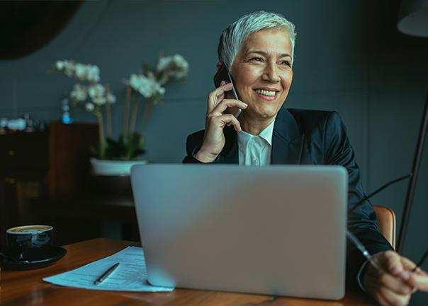 business travel consultant on the phone smiling