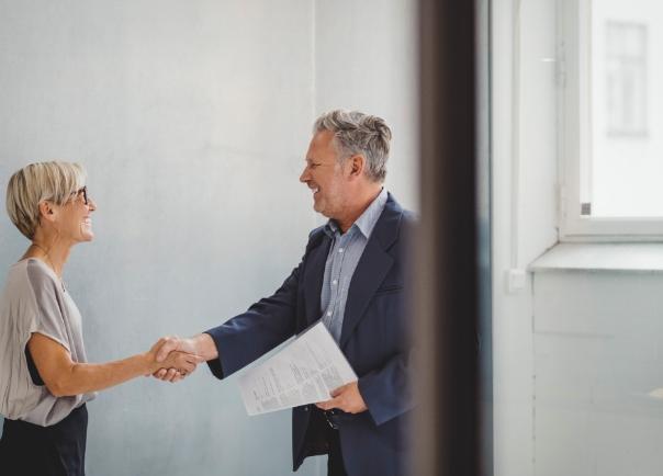 Corporate Travellers shaking hands