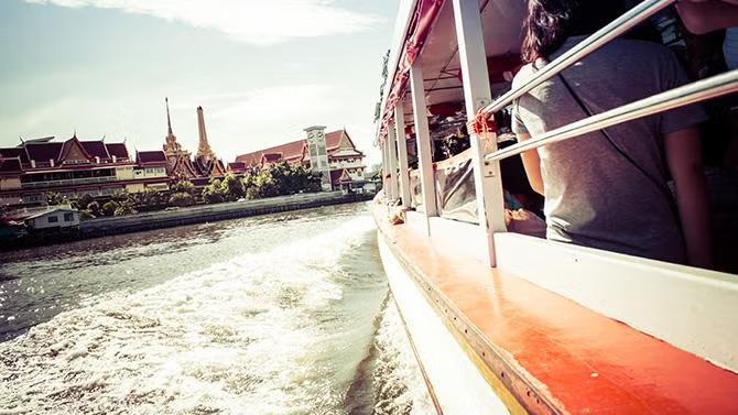 View of the city of Bangkok from a boat, showcasing tourist attraction in the Bangkok travel guide. 