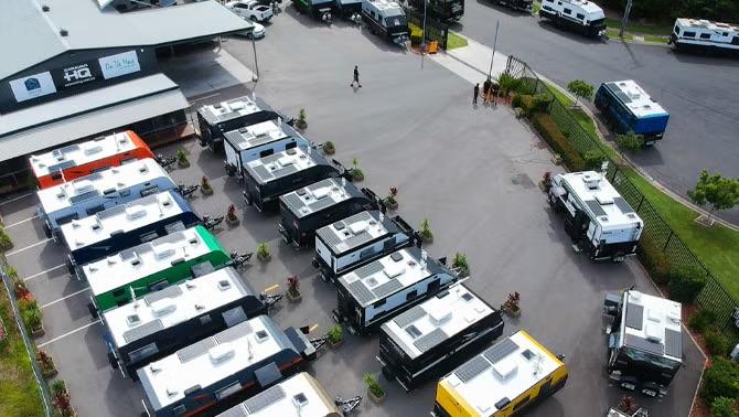 Caravans parked in rows in a parking lot representing how CHQ Group gained financial and logistical control by switching to Corporate Traveller.