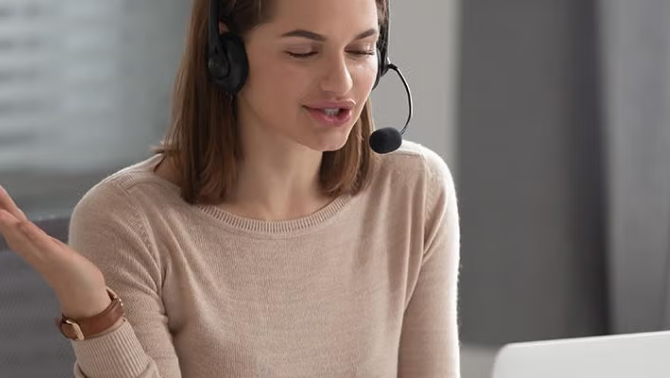 Woman talking on the phone demonstrating how virtual travel assistant adds human touch to Savi