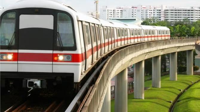 Train moving in the tracks, showcasing tourist attractions in the Singapore travel destination guide. 