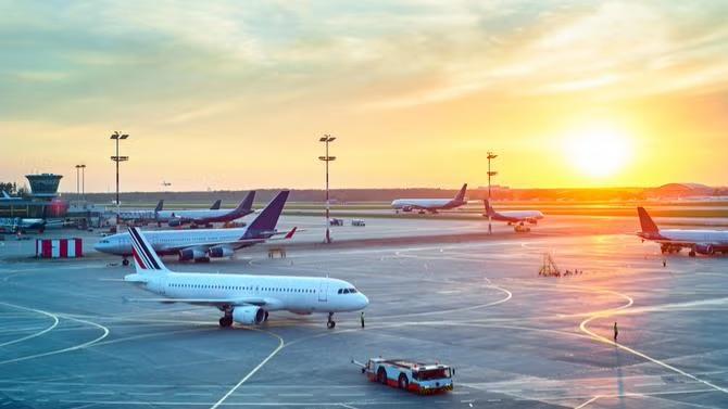 Airplanes parked in the airport, showcasing tourist attractions in the Sydney travel destination guide. 