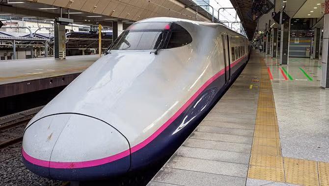 Train in a Tokyo train station demonstrated in the Tokyo destination travel guide.