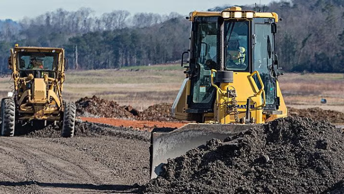 Construction vehicle representing Topcon's world-class travel program.