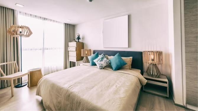 A bedroom in an Airbnb representing the sharing economy trend.