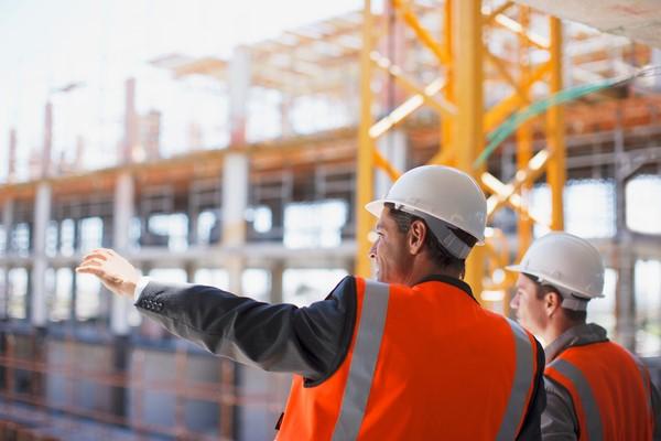 two people working on a construction site