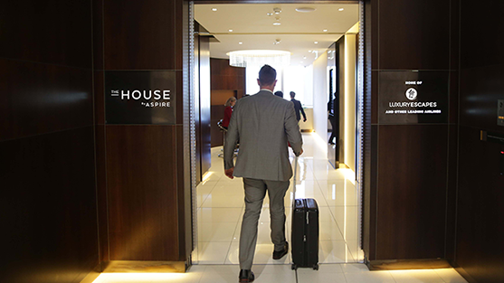 Man in suit enters airport lounge