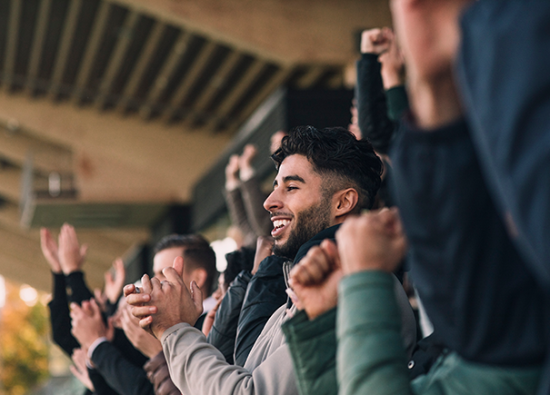 Male sports fan clapping