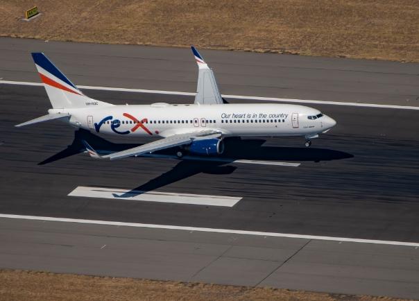 Rex plane on runway